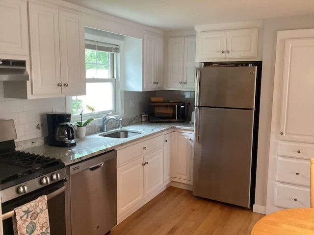 8 Saco Ave, Pocasset, MA 02559 - kitchen featuring appliances with stainless steel finishes, white cabinetry, and light stone countertops