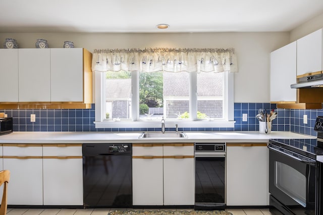 18 Juniper Cir, Brewster, MA 02631 - kitchen with black appliances, a sink, light countertops, and white cabinets