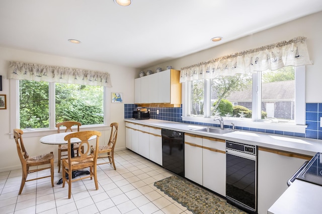 18 Juniper Cir, Brewster, MA 02631 - kitchen with black dishwasher, light countertops, a sink, tasteful backsplash, and recessed lighting