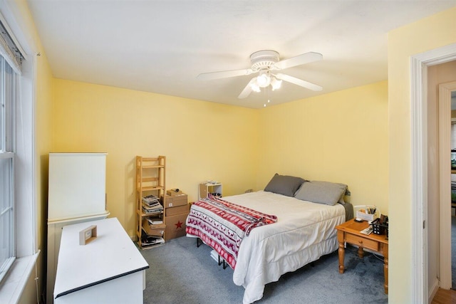 carpeted bedroom featuring ceiling fan