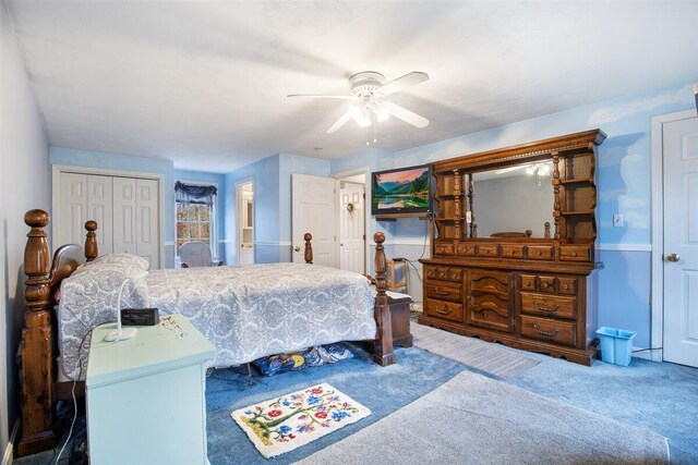 carpeted bedroom with a closet and ceiling fan