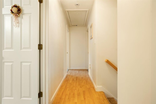 hallway with light hardwood / wood-style flooring