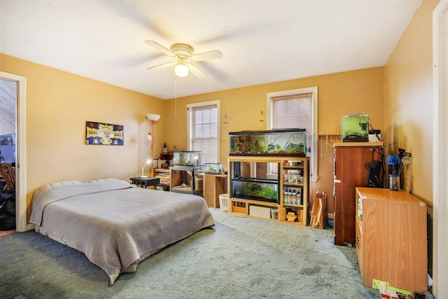 bedroom featuring ceiling fan and carpet flooring