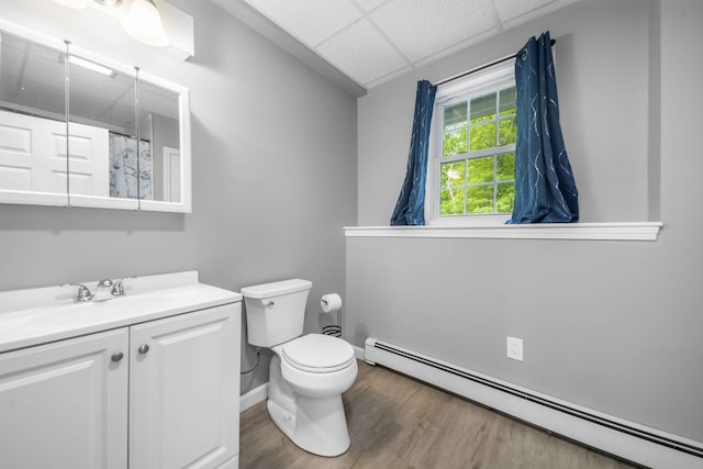 5 Whiffletree Cir, Sandwich, MA 02563 - full bathroom with a baseboard radiator, vanity, toilet, a drop ceiling, and wood finished floors