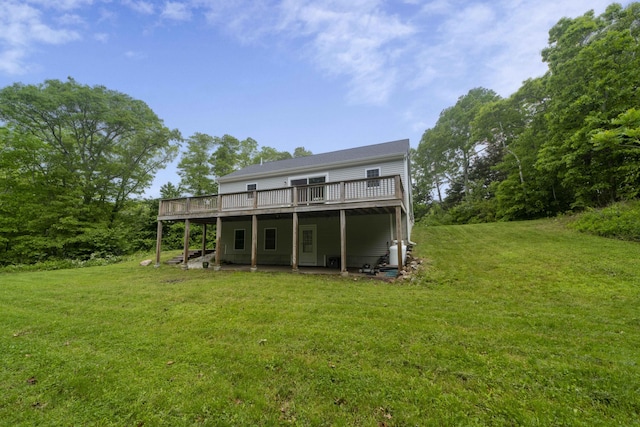 5 Whiffletree Cir, Sandwich, MA 02563 - rear view of property featuring a deck and a lawn