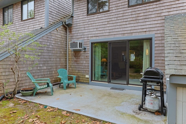146 Crescent Ln, Brewster, MA 02631 - view of exterior entry featuring a patio area and a wall mounted air conditioner