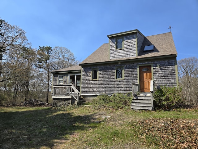 336 Main St, Brewster, MA 02631 - view of front of home featuring a wooden deck, a front lawn, and roof with shingles