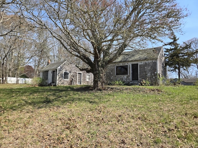 336 Main St, Brewster, MA 02631 - view of front of property with an outdoor structure and a chimney