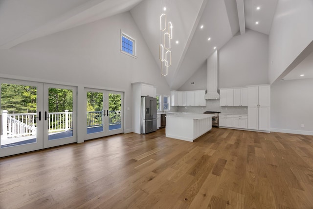 84 Hooppole Rd, Mashpee, MA 02649 - unfurnished living room featuring french doors, high vaulted ceiling, beamed ceiling, light wood-style floors, and recessed lighting