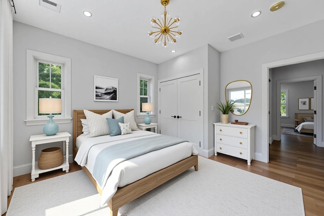 84 Hooppole Rd, Mashpee, MA 02649 - bedroom featuring a chandelier, multiple windows, baseboards, wood finished floors, and recessed lighting