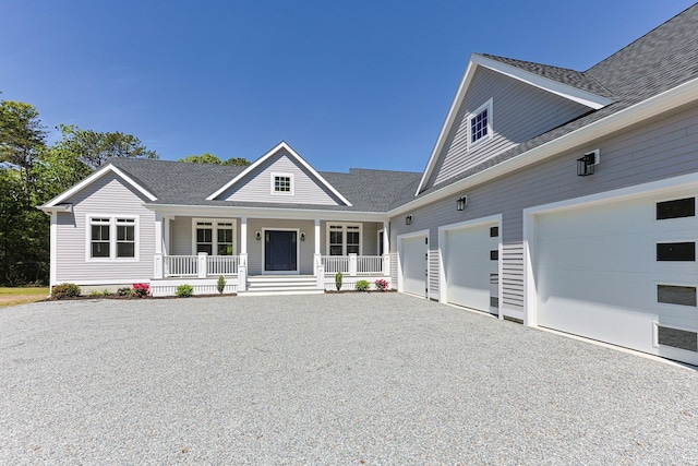 84 Hooppole Rd, Mashpee, MA 02649 - view of front of house with covered porch, driveway, and a shingled roof