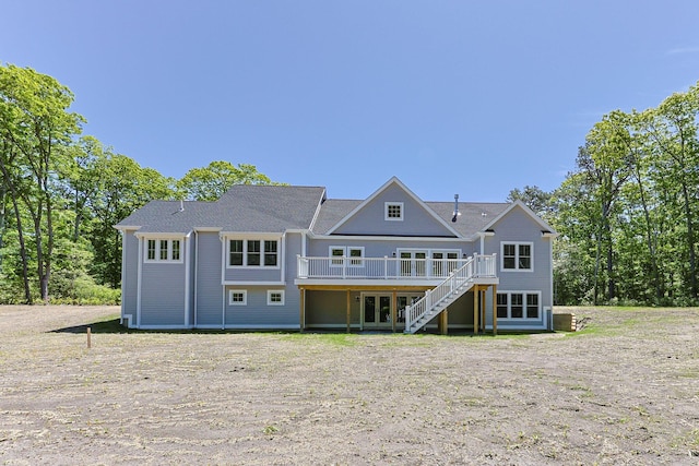 84 Hooppole Rd, Mashpee, MA 02649 - rear view of house with a wooden deck, stairway, and french doors