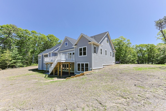 84 Hooppole Rd, Mashpee, MA 02649 - rear view of house with a wooden deck and stairs
