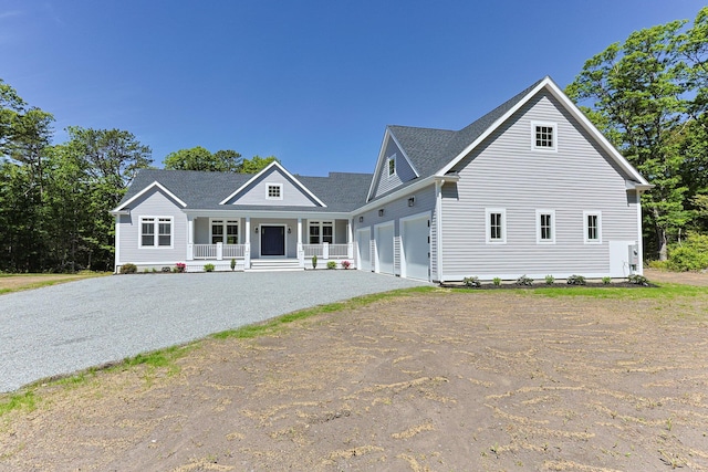 84 Hooppole Rd, Mashpee, MA 02649 - view of front facade with a porch, driveway, an attached garage, and a shingled roof