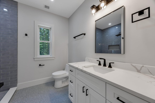 84 Hooppole Rd, Mashpee, MA 02649 - full bath featuring vanity, a tile shower, toilet, and baseboards