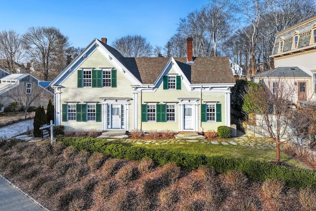 view of front of property with a front lawn