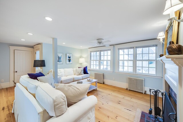 10 Bank St, Wellfleet, MA 02667 - living area featuring radiator heating unit, light wood-type flooring, baseboards, a ceiling fan, and recessed lighting