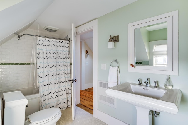 full bathroom with toilet, shower / bathtub combination with curtain, and sink