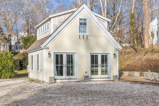 rear view of property with french doors