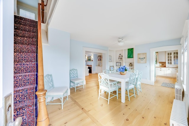 dining room featuring ceiling fan and light wood-type flooring