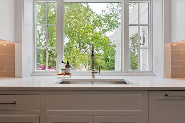 9 Joy Ln, Orleans, MA 02653 - kitchen with a sink, light countertops, healthy amount of natural light, and backsplash