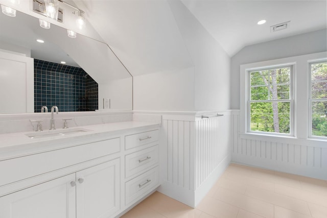 9 Joy Ln, Orleans, MA 02653 - full bath with lofted ceiling, vanity, wainscoting, recessed lighting, and tile patterned flooring