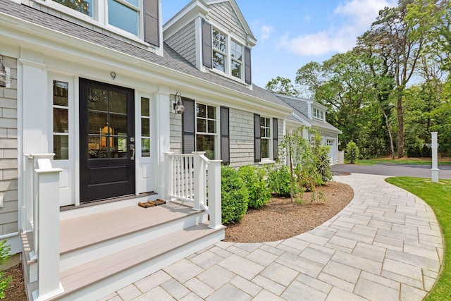 9 Joy Ln, Orleans, MA 02653 - doorway to property featuring roof with shingles and driveway