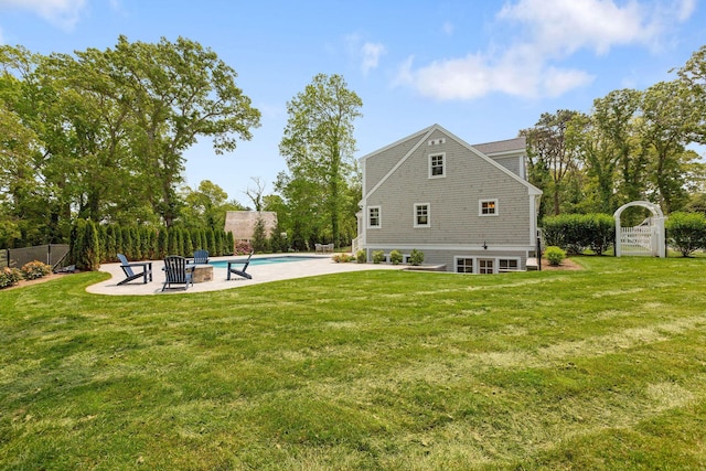 9 Joy Ln, Orleans, MA 02653 - back of property with a patio area and a fire pit