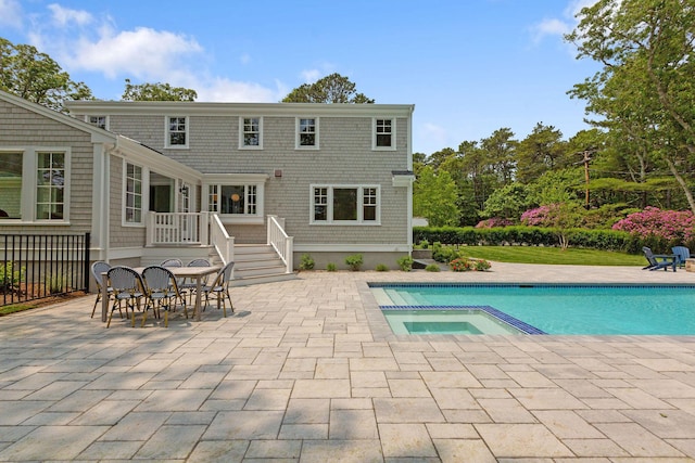 9 Joy Ln, Orleans, MA 02653 - view of swimming pool with a patio, outdoor dining space, a deck, and a pool with connected hot tub