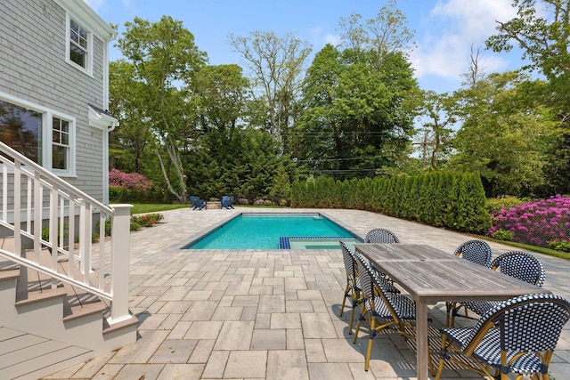 9 Joy Ln, Orleans, MA 02653 - view of pool with a patio area, a pool with connected hot tub, outdoor dining space, and view of wooded area