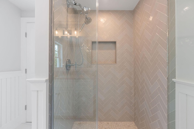 9 Joy Ln, Orleans, MA 02653 - bathroom featuring a shower stall and wainscoting