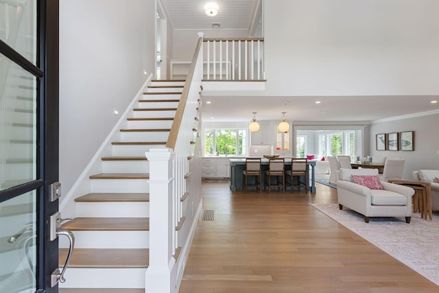 9 Joy Ln, Orleans, MA 02653 - stairs with wood finished floors and crown molding