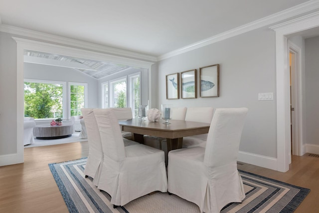 9 Joy Ln, Orleans, MA 02653 - dining area with light wood-style floors, baseboards, crown molding, and lofted ceiling