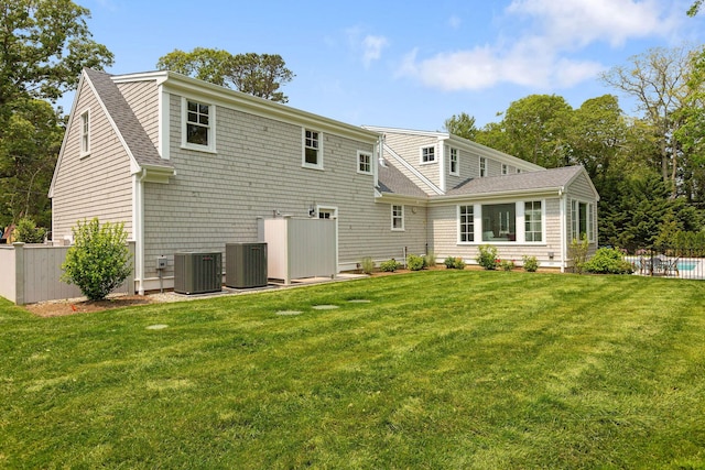 9 Joy Ln, Orleans, MA 02653 - rear view of property with cooling unit and roof with shingles