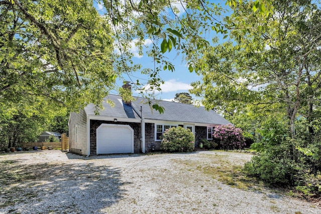 274 Morton Rd, South Chatham, MA 02659 - view of front of home with an attached garage, a chimney, and gravel driveway