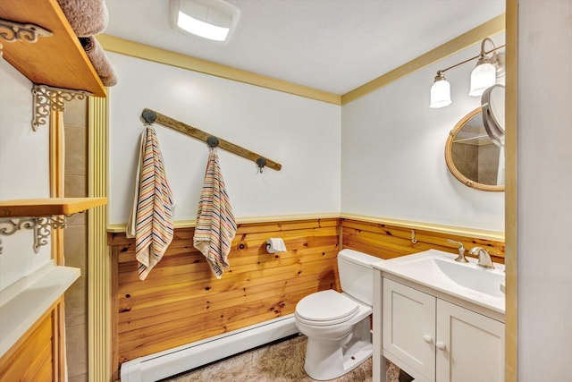 274 Morton Rd, South Chatham, MA 02659 - half bathroom featuring baseboard heating, vanity, toilet, and a wainscoted wall
