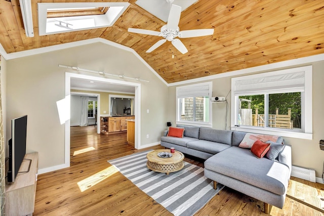 274 Morton Rd, South Chatham, MA 02659 - living room with a skylight, vaulted ceiling, baseboards, a ceiling fan, and wood finished floors