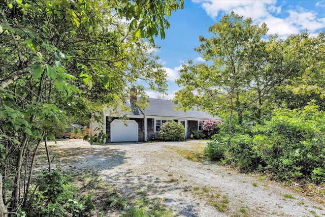 274 Morton Rd, South Chatham, MA 02659 - view of front facade with dirt driveway and an attached garage