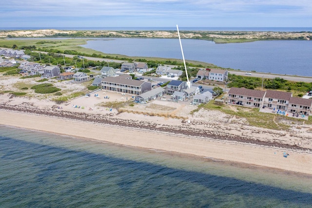 bird's eye view featuring a water view and a view of the beach