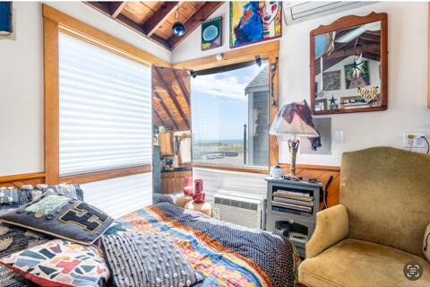 sitting room featuring wooden ceiling, lofted ceiling with beams, and a wall mounted air conditioner