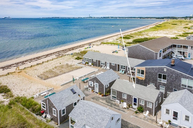 birds eye view of property featuring a water view and a view of the beach