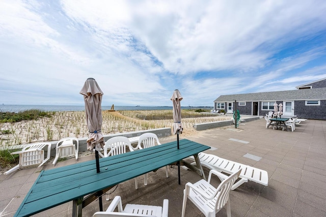 view of patio / terrace featuring a water view