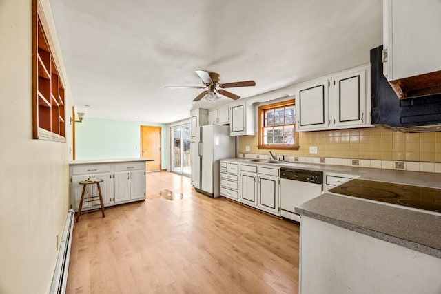 261 Old Chatham Rd, South Dennis, MA 02660 - kitchen with white appliances, a sink, a ceiling fan, tasteful backsplash, and light wood-type flooring