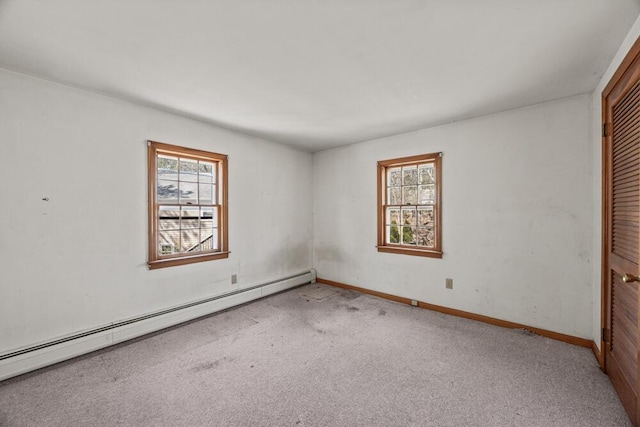 261 Old Chatham Rd, South Dennis, MA 02660 - unfurnished bedroom featuring a baseboard heating unit, carpet floors, a closet, and baseboards