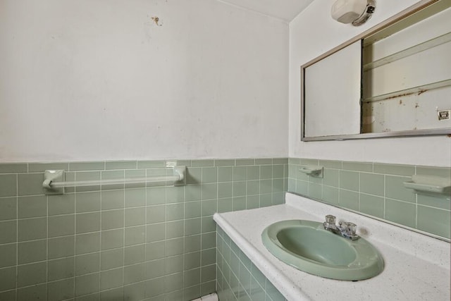 261 Old Chatham Rd, South Dennis, MA 02660 - bathroom featuring tile walls, vanity, and wainscoting