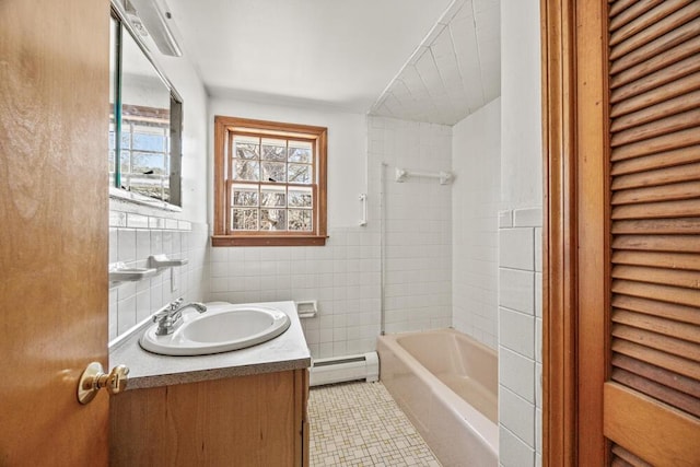 261 Old Chatham Rd, South Dennis, MA 02660 - full bathroom with baseboard heating, vanity, tile walls, and bathing tub / shower combination