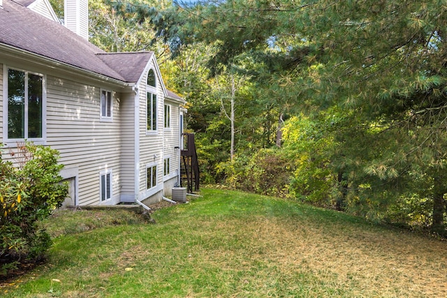 181 Leisure Green Dr, Mashpee, MA 02649 - view of green lawn featuring central AC unit and stairway