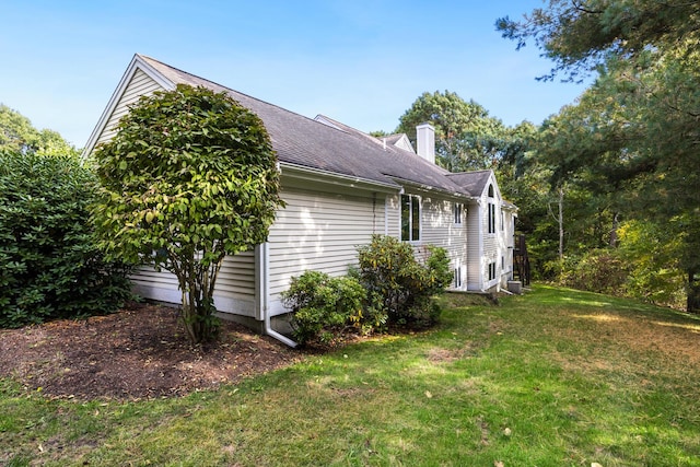 181 Leisure Green Dr, Mashpee, MA 02649 - view of property exterior featuring a chimney and a yard