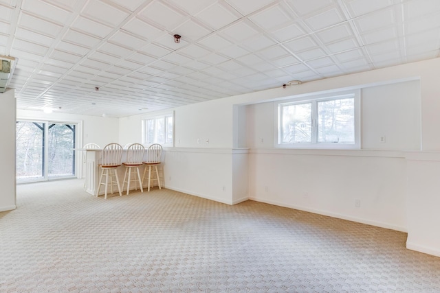 181 Leisure Green Dr, Mashpee, MA 02649 - basement featuring carpet flooring, baseboards, and a dry bar