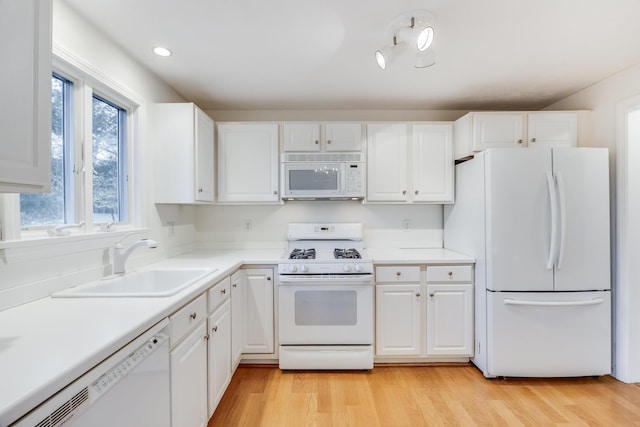 181 Leisure Green Dr, Mashpee, MA 02649 - kitchen featuring white appliances, a sink, white cabinetry, light countertops, and recessed lighting